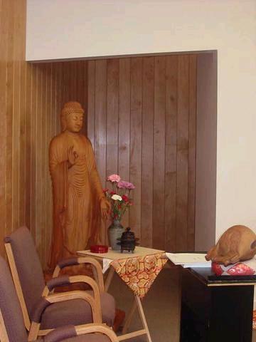 A life size wooden statue of Amida Buddha