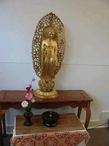 Small golden statue of the historical Buddha